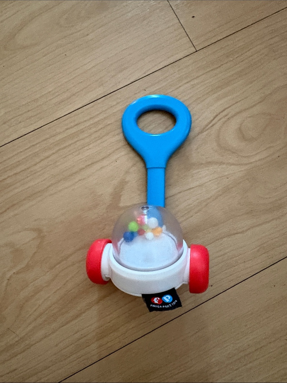 Fisher-Price Blue Handle Rattle Push Toy with Red Wheels